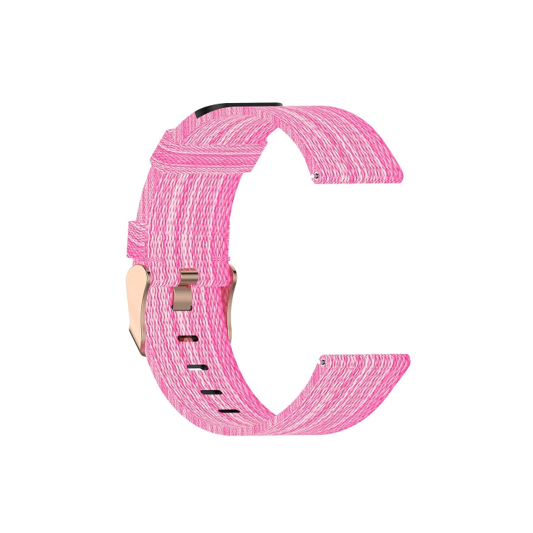 Canvas watch strap in bright pink with metal clasp and textured woven pattern