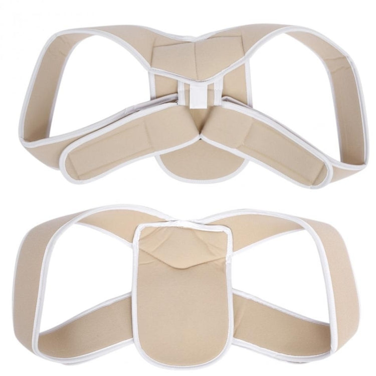 Children’s posture corrector brace laid flat: beige pads with white edging