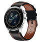 Genuine leather watch band, black with brown lining and red tricolor stitching, metal clasp.