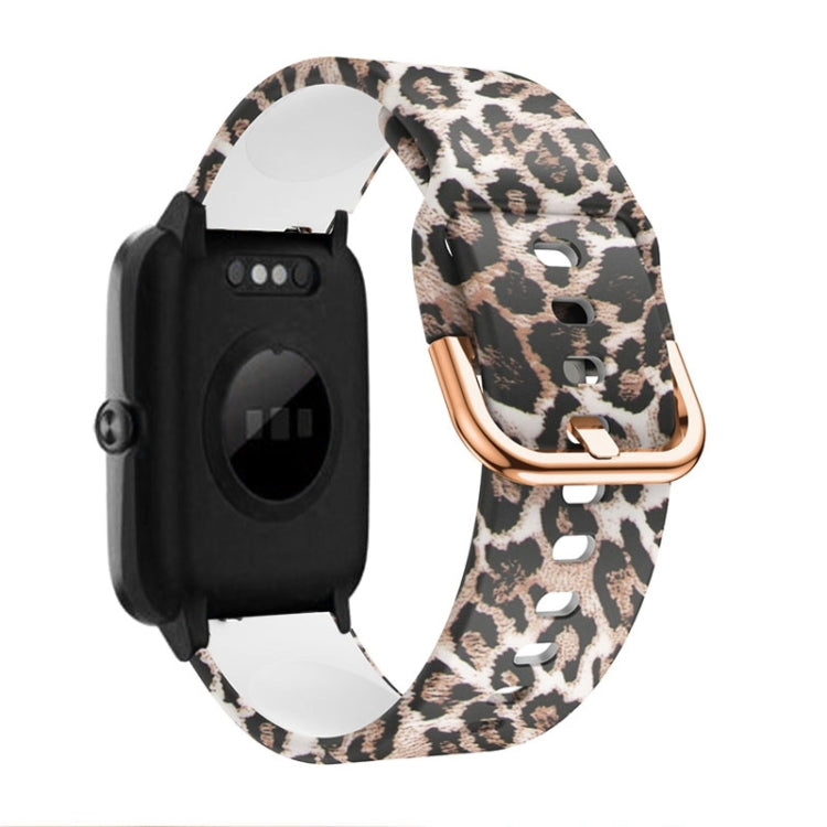 Leopard print silicone watch band with rose-gold buckle and clasp, black watch module.