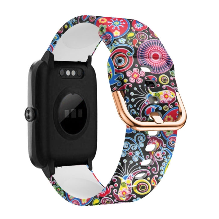 Colorful paisley silicone watch band with rose-gold buckle and clasp, black watch module.