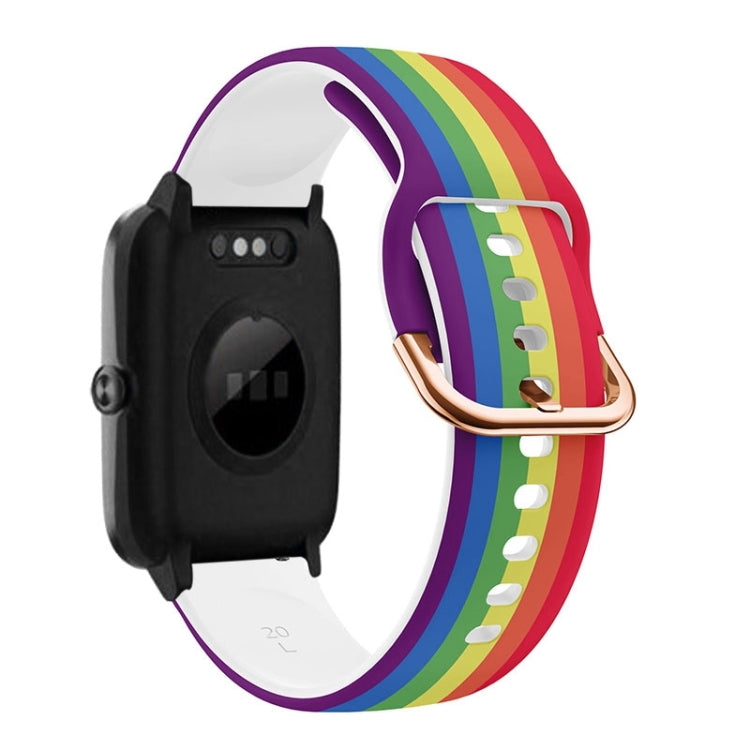 Rainbow stripe silicone watch band with rose-gold buckle and clasp, black watch module.