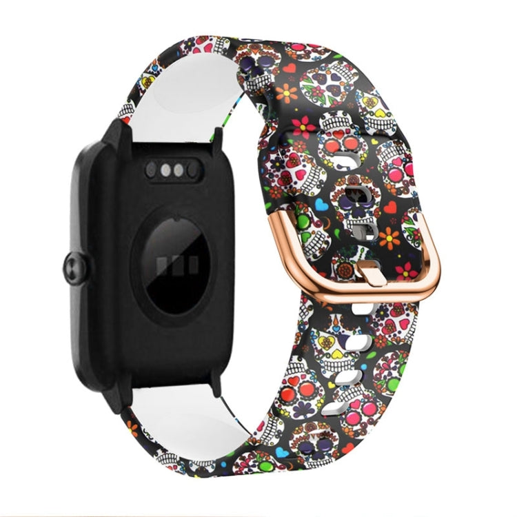 Skull and heart print silicone watch band with rose-gold buckle and clasp, black watch module.