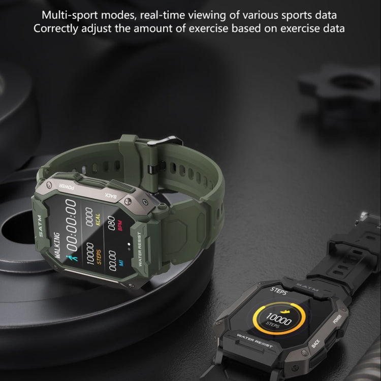 Green smartwatch on round stand showing activity numbers and side controls