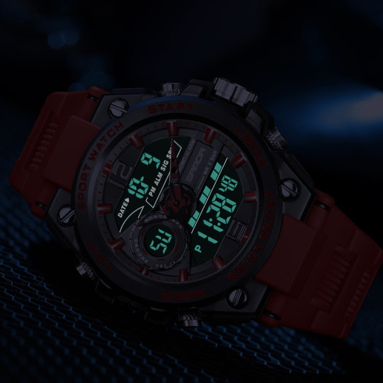 Red digital sports watch with round bezel, luminous screen digits, silicone strap