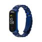 Three-bead metal watch band in blue with a slim watch case and glossy linked links