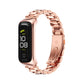 Three-bead metal watch band in rose gold with linked bracelet around a black watch case