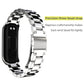 Silver three-bead metal watch band with clasp and hinged links, close-up detail