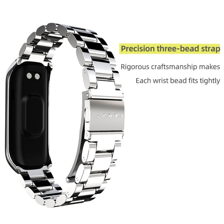 Silver three-bead metal watch band with clasp and hinged links, close-up detail