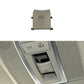 Light grey-beige sunroof dome light switch button with vent-style icon and side mounting tabs