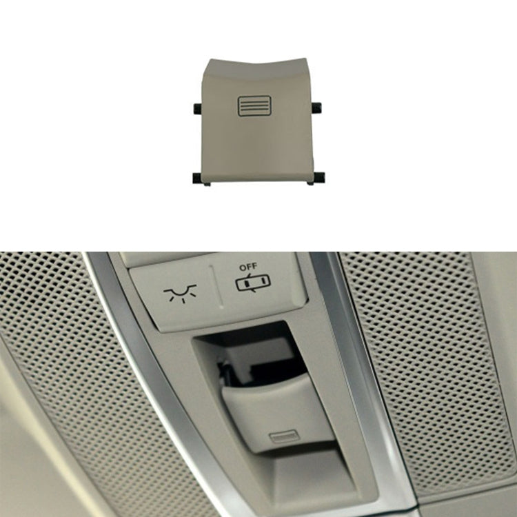 Light grey-beige sunroof dome light switch button with vent-style icon and side mounting tabs