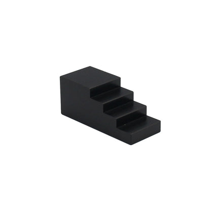 Black stepped lock hub nut tool block with multi-level profile