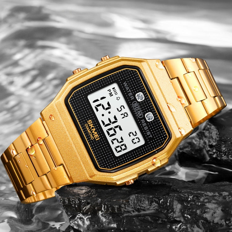 Gold digital sports watch close-up with square LCD face and linked metal bracelet