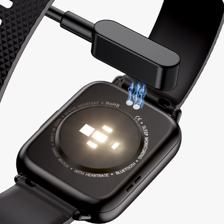 Square smartwatch close-up with black silicone strap and lit display, charging ports visible