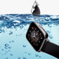 Waterproof-style smartwatch with black strap, angled view over water droplets
