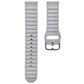 Light gray silicone watch band with ridged texture and metal pin buckle, close-up.