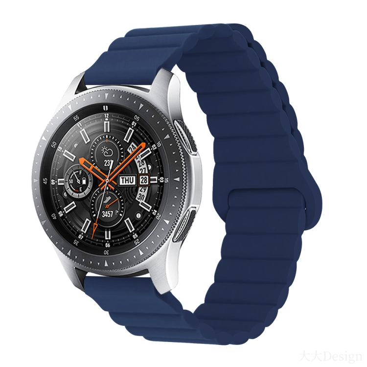 Smart watch with midnight blue silicone band and metal clasp, round black dial with orange details