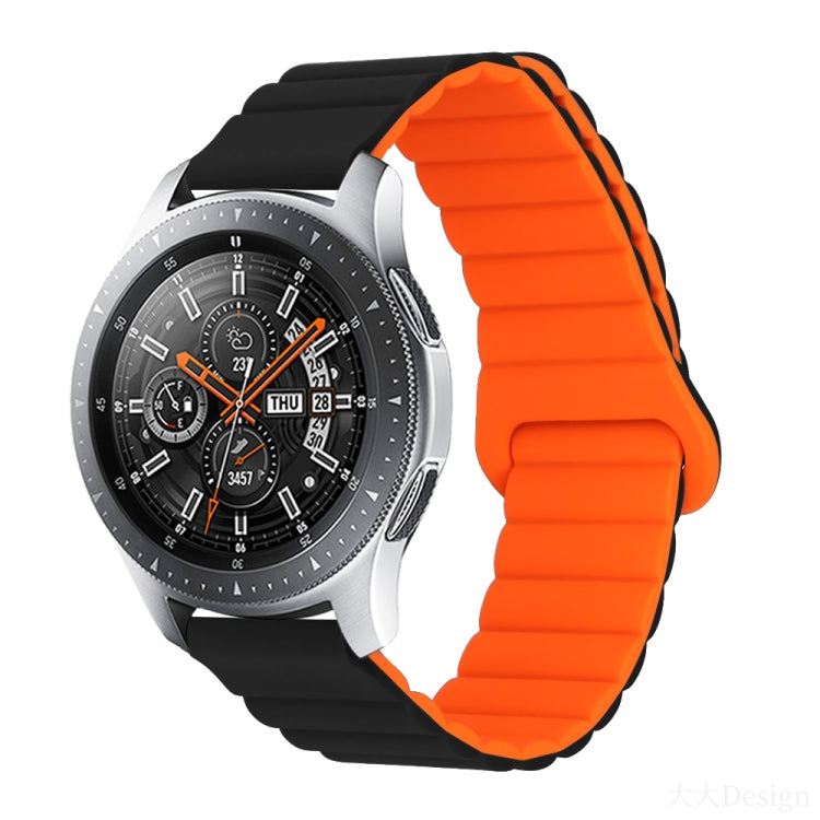 Smart watch with orange silicone band and metal clasp, round black dial with orange details