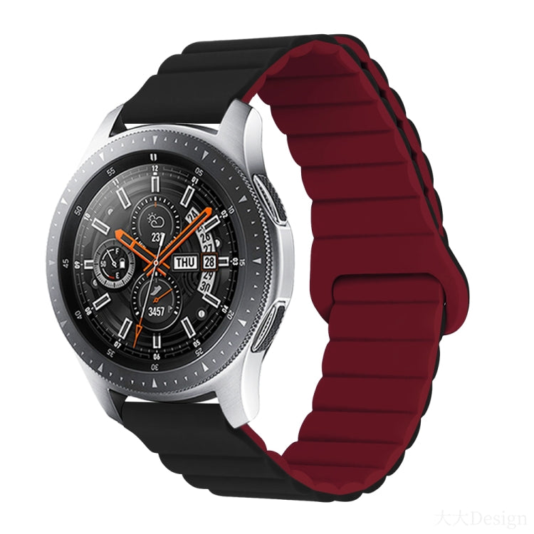 Smart watch with maroon silicone band and metal clasp, round black dial with orange details