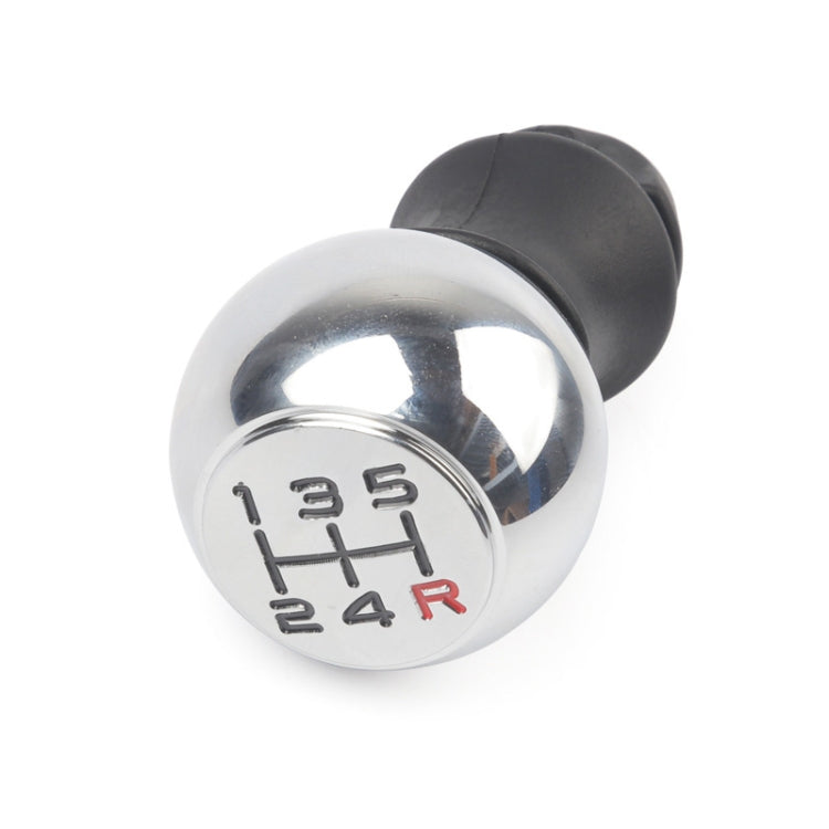 Gear shift knob with 5-speed H-pattern on chrome cap, black rubber collar and stem