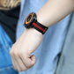 Black milan chain watch band with red stripe on wrist