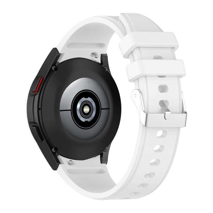 Silicone watch band in white with perforated strap and metal clasp, side view