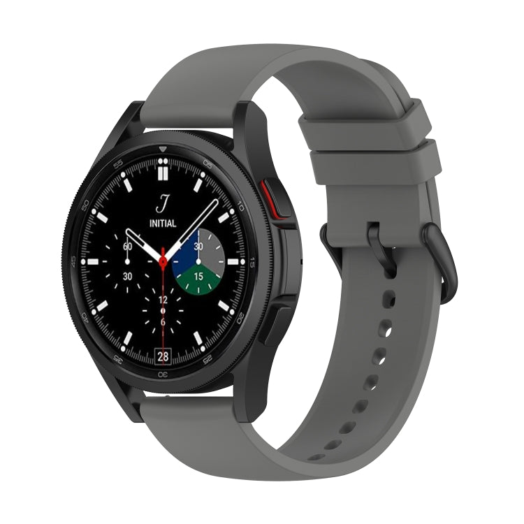 Dark grey silicone watch band with clasp and perforated strap on watch front