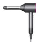 Curling nozzle attachment mounted on a black hair dryer body with silver barrel.