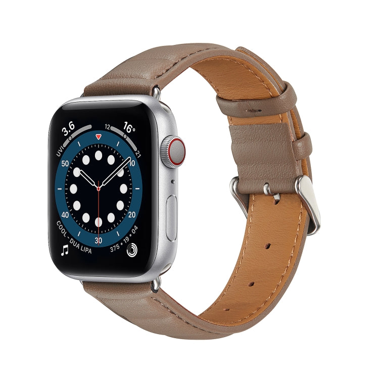 Genuine leather watch band in tan/brown with metal buckle, adjustable holes, and stitching.