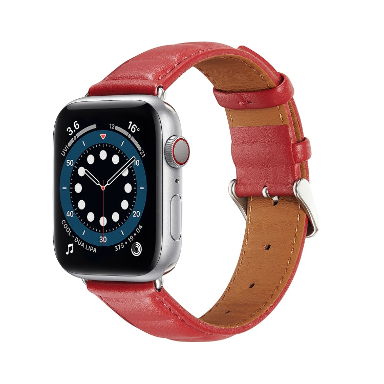 Red genuine leather Apple Watch band with metal buckle and tan underside on watch