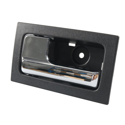 Left front interior door handle, black bezel with chrome lever and circular insert