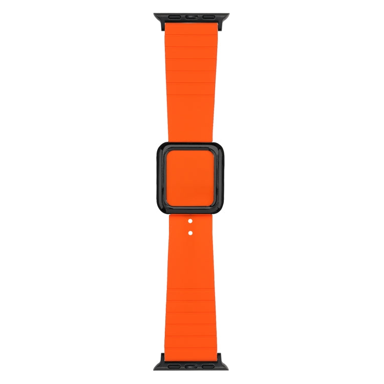 Square-buckle silicone watch band in bright orange with black connector accents
