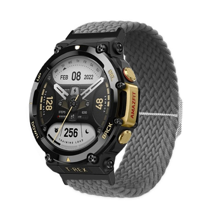 Gray braided nylon watch band with adjustable buckle and thick knitted texture on a black watch