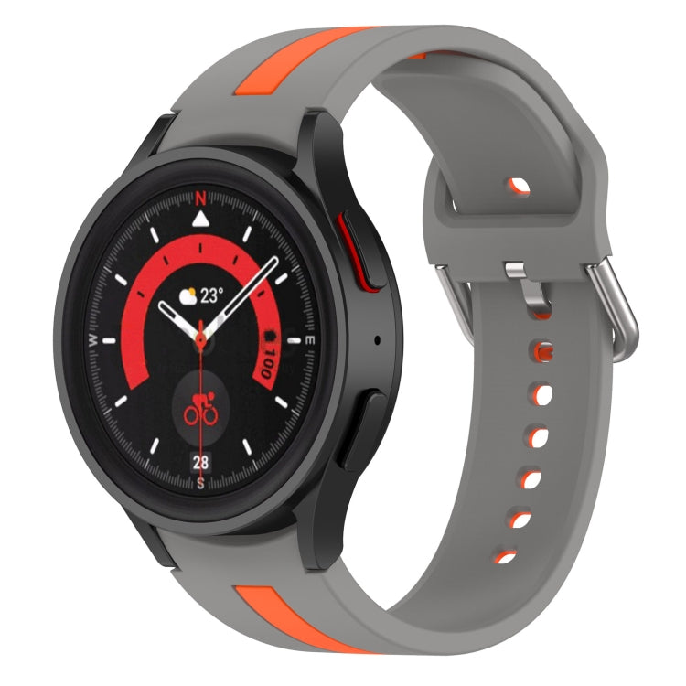 Two-tone striped silicone watch band with orange accents and grey strap for Galaxy Watch.