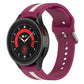 Two-tone striped silicone watch band in magenta with white stripe and perforated adjustment holes.