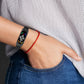 Black Milan metal watch band worn on wrist, compatible with Xiaomi Mi Band 7/7NFC