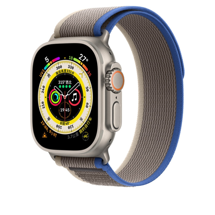 Blue and grey nylon watch band with Apple Watch face, textured fabric strap.