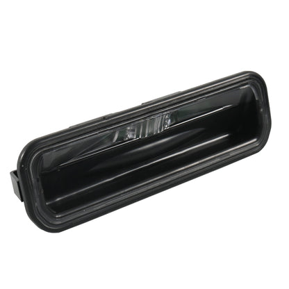 Black trunk door switch assembly with clear light lens and mounting tabs