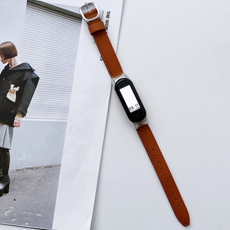 Brown genuine leather watch band with silver buckle and black smartwatch face