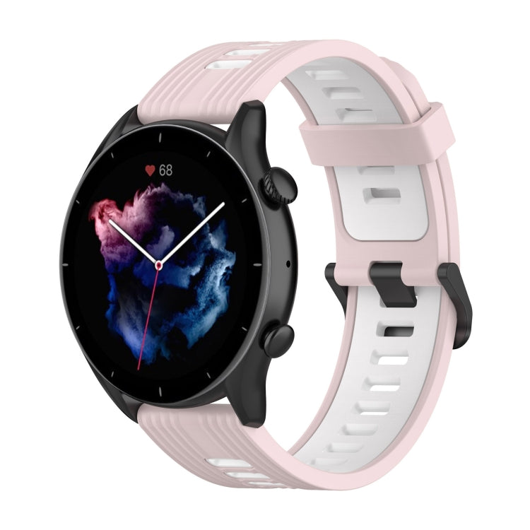 Two-color silicone watch band with light pink strap and pale white buckle-style clasp.