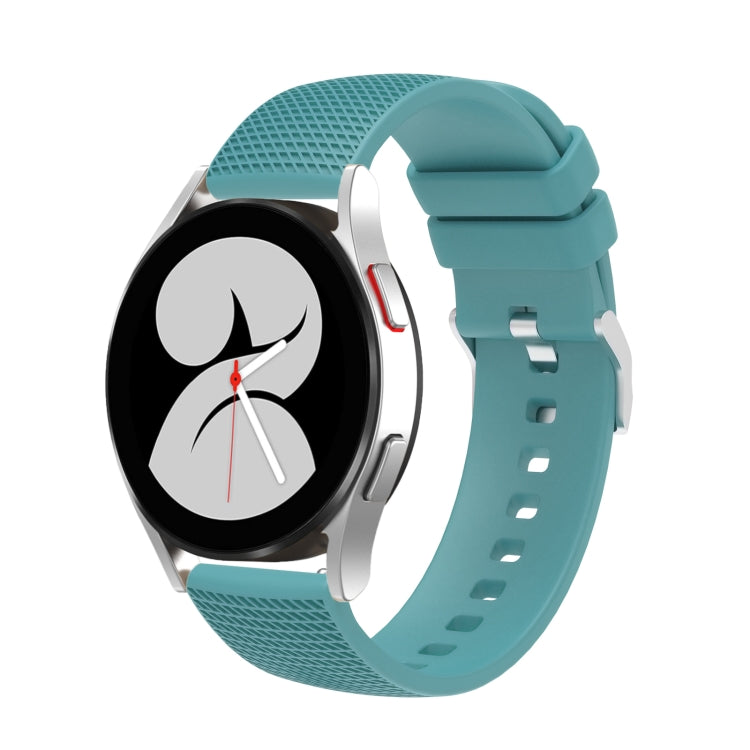 Turquoise silicone watch band with pockmarked silver buckle and strap holes