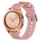 Pink silicone watch band with vertical grain texture, buckle clasp, and strap holes