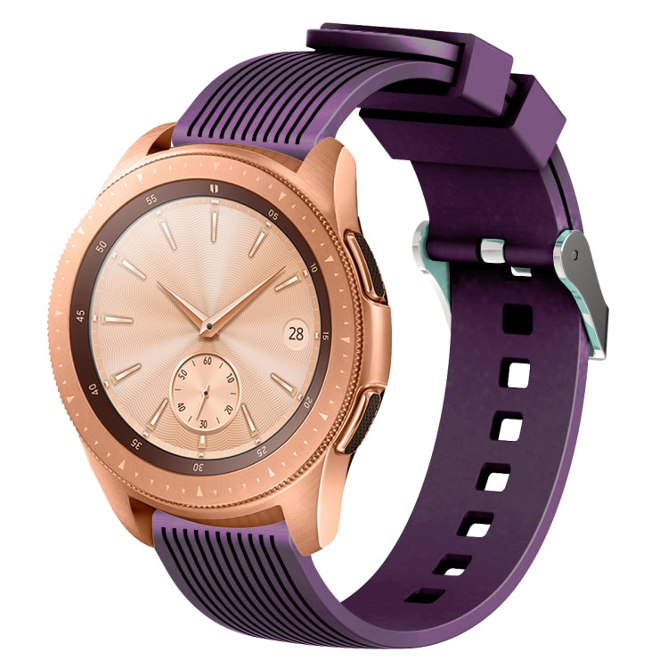 Purple silicone watch band with vertical grain texture, buckle clasp, and strap holes