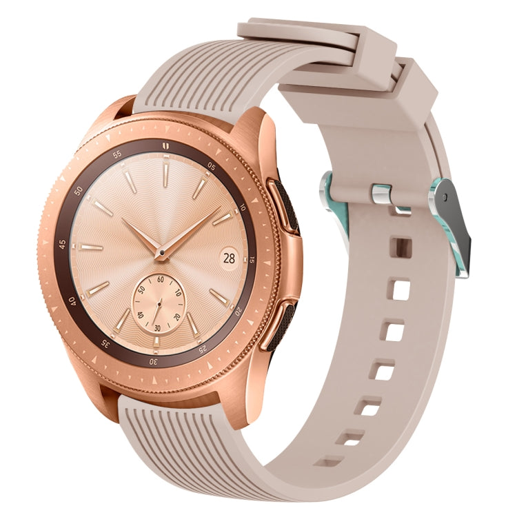 Khaki silicone watch band with vertical grain texture, buckle clasp, and strap holes