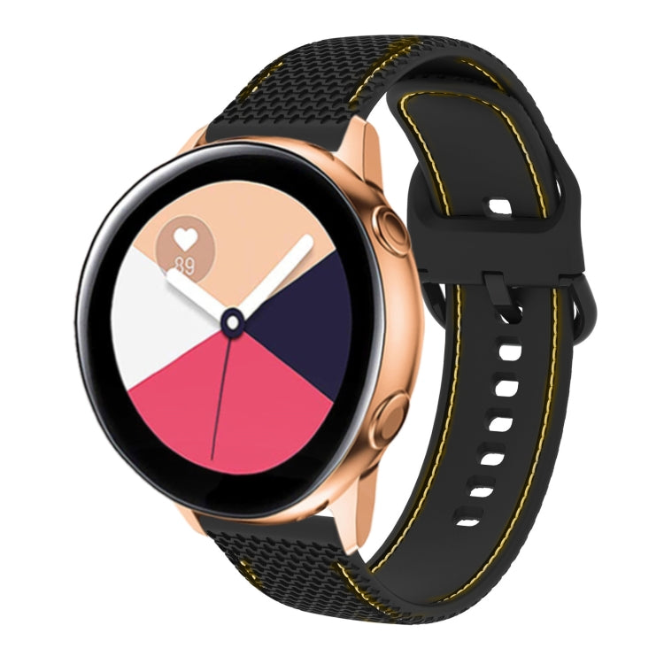 Two-color silicone watch band with black mesh texture and yellow contrast stitching