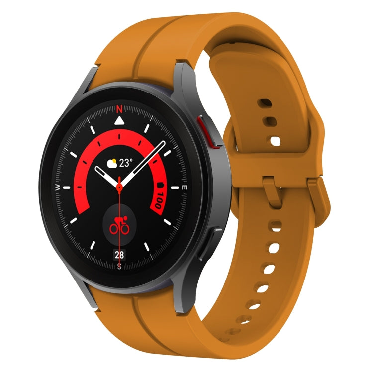 Orange silicone watch band with buckle and perforated strap holes for secure fit