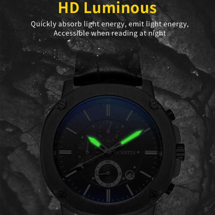 Men's multifunction watch showing green luminous hands on a dark dial with black leather strap.