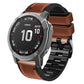 Brown silicone leather watch band with orange tricolor stitching and black link-style strap