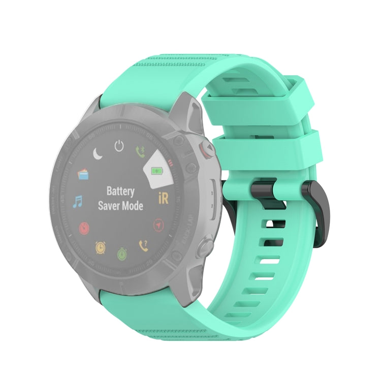 Quick-release watch wrist strap with plastic buckle, light teal textured silicone band.