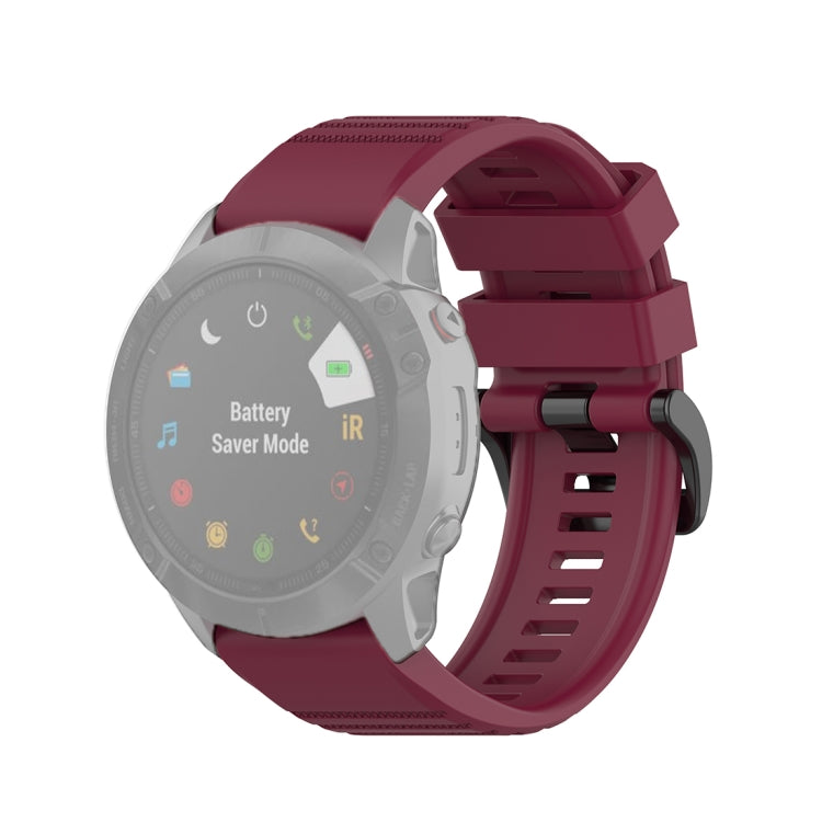 Quick-release watch wrist strap with plastic buckle, burgundy textured silicone band.